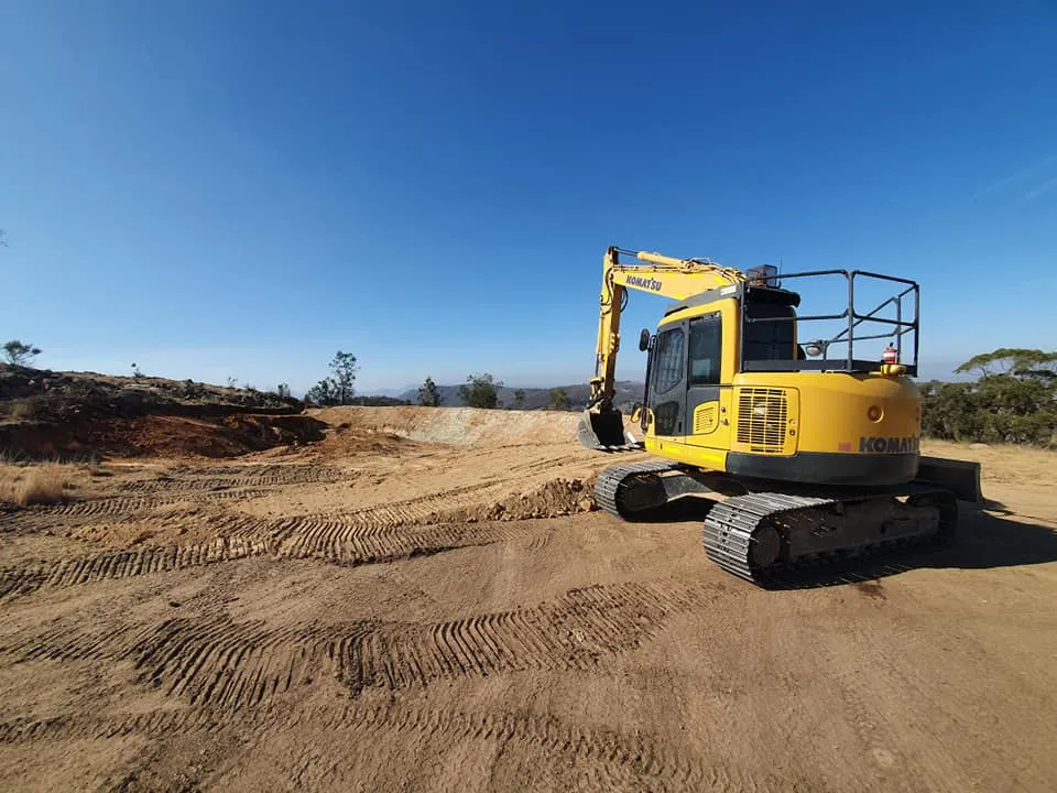 Yellow excavator on a construction site